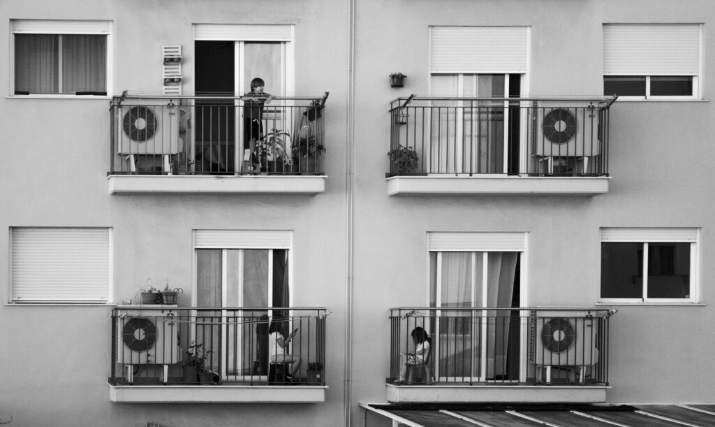 children playing on balconies of modern building